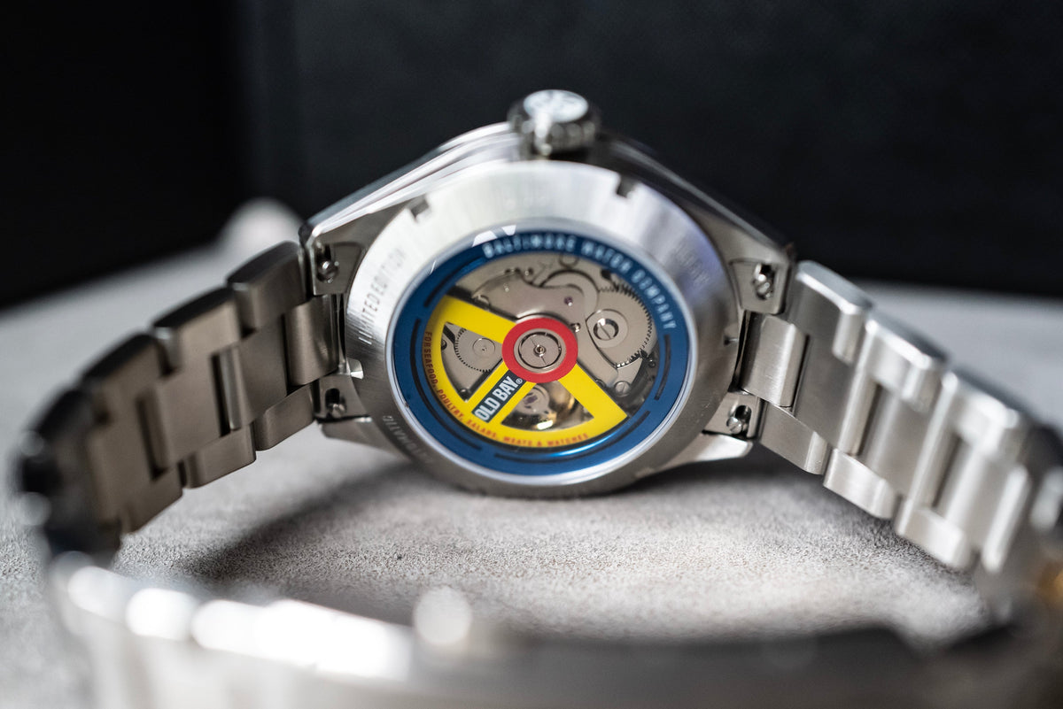 The exhibition caseback reveals the decorated automatic rotor.